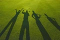 Four golfers silhouette on grass Royalty Free Stock Photo