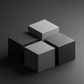 Four gray cubes are arranged in a two-by-two formation on a dark surface. The Royalty Free Stock Photo