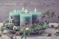 Four green christmas candle