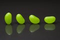 Four green jellybeans