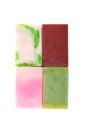 Four handmade soap bars with different organic ingredients