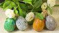 Four handpainted Easter eggs and flowers Royalty Free Stock Photo