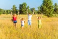 Four happy beautiful children running playing moving together in the beautiful summer day. Royalty Free Stock Photo