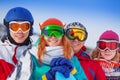 Four happy snowboarders wearing goggles Royalty Free Stock Photo