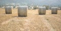 Four hay stacks in a field