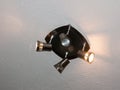 Four headed metal shiny lamp ceiling up above on