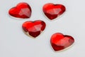 Four hearts in red glass