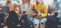 Four Hipsters Friends Sitting Sofa Using Electronic Gadgets.Creative Department Working Together Digital Devices Royalty Free Stock Photo