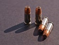 Four hollow point bullets on a black background Royalty Free Stock Photo