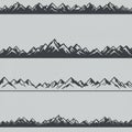 Four horizontal mountain range designs in solid black with white highlights, suggest a Royalty Free Stock Photo