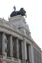 Four horse chariot sculpture on top of Banco Bilbao Vizcaya building in Madrid, Spain. Vertical shot