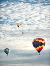 Four hot air balloons at a balloon rally. Royalty Free Stock Photo