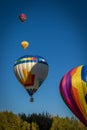 Four Hot Air Balloons in a Line Flying at Different Altitudes