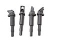 Four ignition coils for an internal combustion engine of a car during repair and service on a white isolated background. Spare