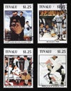 Four illustrations by Norman Rockwell about baseball on stamps