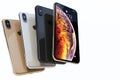 Four iPhone Xs Gold, Silver and Space Grey composition on white Royalty Free Stock Photo