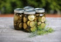 Four Jars of Homemade Dill Pickles with Dill Flower