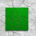 Four jigsaw puzzles with green grass Royalty Free Stock Photo