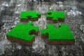 Four jigsaw puzzles with green grass red soil Royalty Free Stock Photo