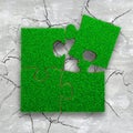 Four jigsaw puzzles with green grass Royalty Free Stock Photo