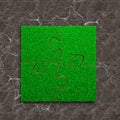 Four jigsaw puzzles with green grass Royalty Free Stock Photo