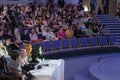 Four jurors sitting at the table during cosplay contest