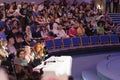 Four jurors sitting at the table during cosplay contest