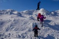 Four Kids Climbing a Snow Drift Royalty Free Stock Photo