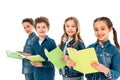 Four kids in denim clothes holding books isolated on white. Royalty Free Stock Photo