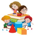 Four kids on giant books Royalty Free Stock Photo