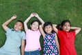 Four kids having fun in the park. Royalty Free Stock Photo