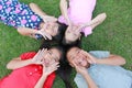 Four kids having fun in the park.