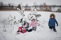 Four kids having fun at winter day Royalty Free Stock Photo