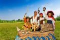 Four kids in pirate costumes behind ship Royalty Free Stock Photo