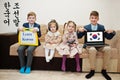 Four kids show inscription learn korean. Foreign language learning concept
