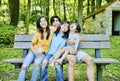 Four kids sitting on bench Royalty Free Stock Photo