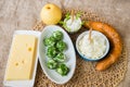 Four kinds of cheese, apple and bread. Royalty Free Stock Photo