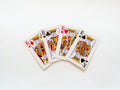 Four kings from a deck of playing cards isolated on a white background. Pik, club, diamond and heart suit