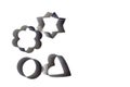 Four metal cookie cutters on a white background