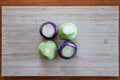 Four Kohlrabi Pealed On A Vintage Bamboo Board