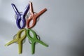 Four large cloth clamps in various colors on a white background.