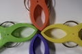 Four large cloth clamps in various colors on a white background.