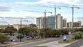 Four large cranes on construction project Southwestern Medical District in Dallas, Texas