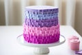 four-layer birthday cake with fondant decor