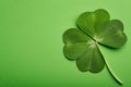 Four leaf clover on green background, st patrick's day. Generative AI Royalty Free Stock Photo