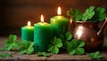 four-leaf clovers and candles on a wooden table on St. Patrick\'s Day Royalty Free Stock Photo