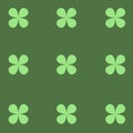 Four leaf petals seamless texture. Green plant on a green background.