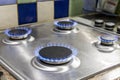 Four lit gas hobs Royalty Free Stock Photo