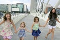 Four little girl group walking in the city Royalty Free Stock Photo