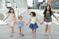 Four little girl group walking in the city Royalty Free Stock Photo